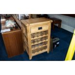 A Contemporary Golden Oak Kitchen Wine Rack/Cutting Block, with a single drawer and wine rack below.