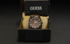 Gentleman's Guess Watch, brown leather strap, in original box with instructions and sales receipt.