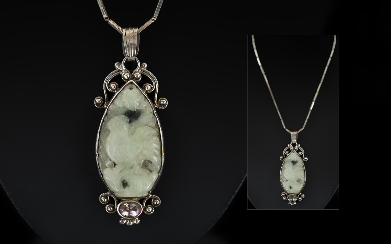 Antique Period Chinese Carved Jade Pendant Attached to a Sterling Silver Chain.