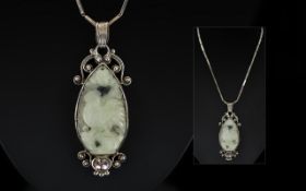 Antique Period Chinese Carved Jade Pendant Attached to a Sterling Silver Chain.