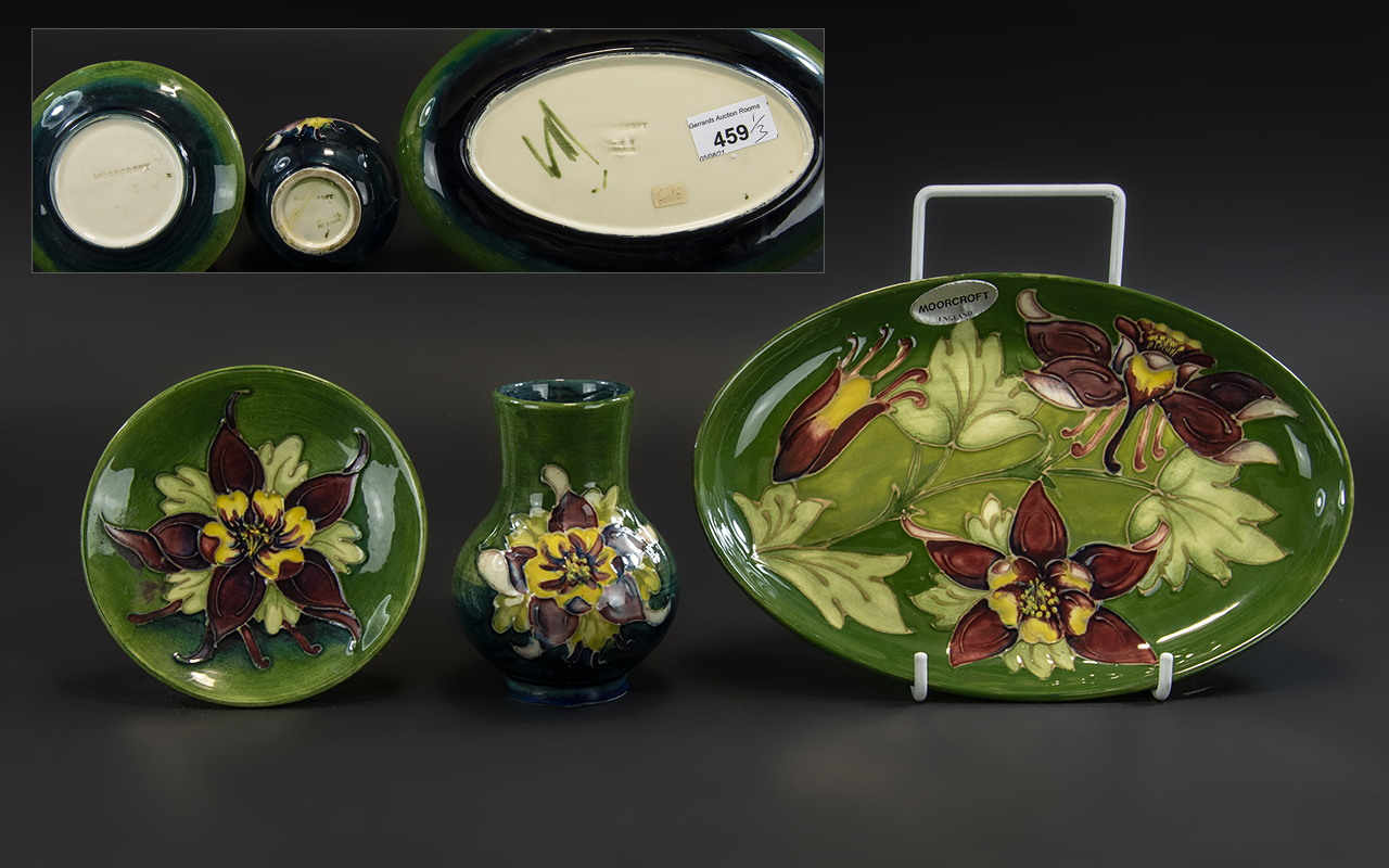 Moorcroft Trio of Hand Painted Tubelined Pieces comprising vase, pin dish and oval tray,