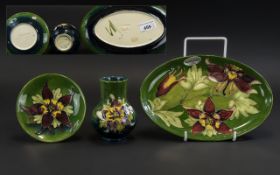 Moorcroft Trio of Hand Painted Tubelined Pieces comprising vase, pin dish and oval tray,