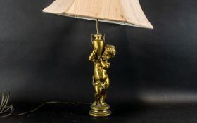 A Gold Cherub Style Table Lamp with Shade. Please See Photo.