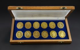 A Set of ( 12 ) Ltd Edition Gilt on Silver Medallions. The Arms of H.R.