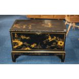 A Chinoiserie Decorated Pine Black Lacquered Bedding Box, with a candle box interior,