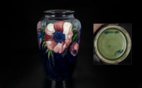 Moorcroft - Tubelined Vase of Tapered Form ' Anemone ' Design on Blue Ground. c.1975 - 1980.