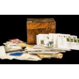 An Antique Walnut Hinged Box containing a small quantity of stamps to include First Day Covers,