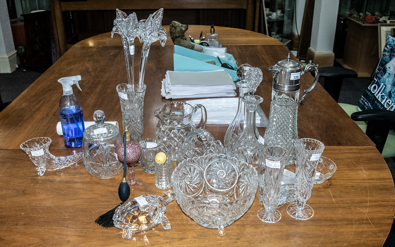Collection of Cut Glass Oddments, consisting of a claret jug, two decanters, basket, lidded