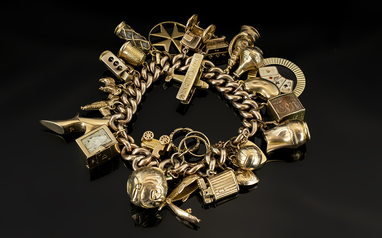 A Vintage 9ct Gold Curb Bracelet Loaded with 25 Superior Quality 9ct Gold Charms.