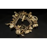 A Vintage 9ct Gold Curb Bracelet Loaded with 25 Superior Quality 9ct Gold Charms.