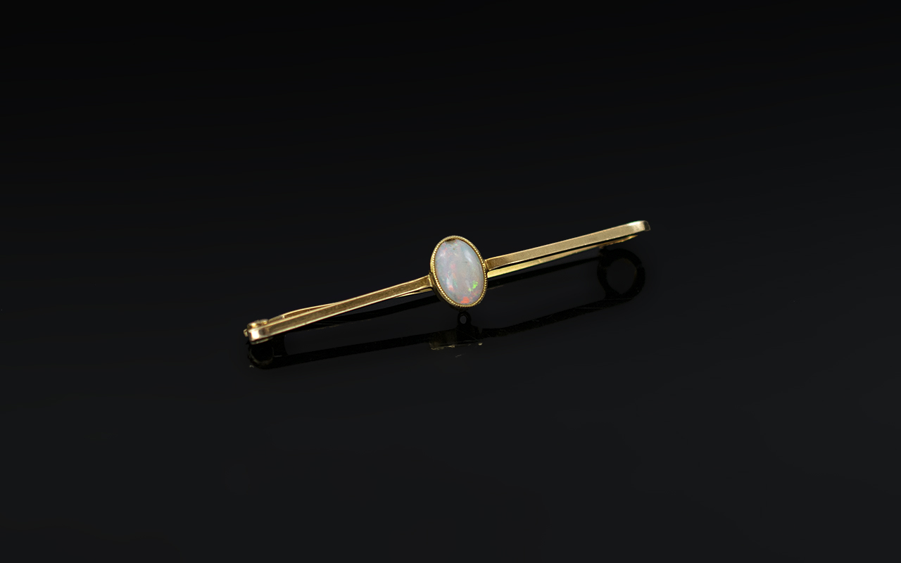 Victorian Period 15ct Gold - Opal Set Brooch. The Central Oval Shaped Opal of Good Colours.