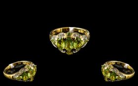 Peridot and Topaz Cluster Ring, five graduating, oval cut peridots, set across the finger, with a