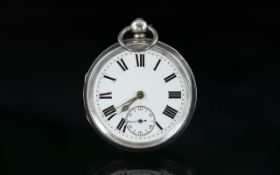 Large Silver Pocket Watch with white enamel dial, in working order.