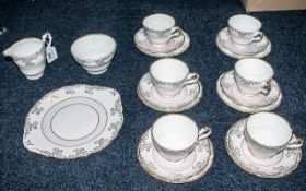Regency Fine Bone China Tea Set, in white ground with pink and gilt pattern, comprising: 6 trios