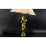 A Gold Cherub Style Table Lamp with Shad
