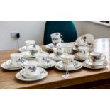 Radfordian Tea Service, comprising seven trios of cup, saucer and side plates,