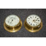 A Brass Porthole Clock with Roman numerals, painted dial together with matching aneroid barometer.