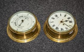 A Brass Porthole Clock with Roman numerals, painted dial together with matching aneroid barometer.