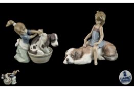Lladro Pair of Hand Painted Porcelain Figures - Girls Washing Their Pet Dogs.