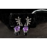 Amethyst and Diamond Drop Earrings, two solitaire pear cut amethysts of 2.75cts each and of rich