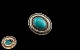 Large Egyptian Style Brooch set with a large cabochon cut turquoise;
