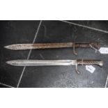 German Model 1898/05 Bayonet, with saw back removed. No scabbard, together with one other.