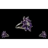 Deep Purple Amethyst Cluster Ring, eight marquise cut amethysts, totalling 4cts, form an