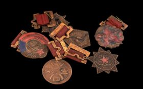 A Collection of Chinese War Medals some with ribbon and enamel.