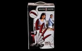 Brand New Boxed Signature Collection 5 Piece Ceramic Knife Set, with peeler, on acrylic stand.