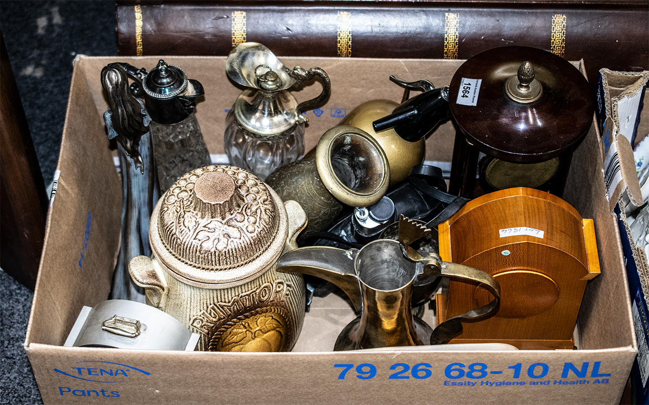 A Box of Miscellaneous to include three mantle clocks, assorted figures, modern claret jugs,