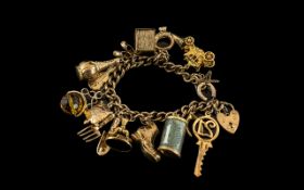 Mid 20th Century - 1950's 9ct Gold Charm Bracelet Loaded with 16 Good Quality Charms.