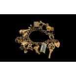 Mid 20th Century - 1950's 9ct Gold Charm Bracelet Loaded with 16 Good Quality Charms.