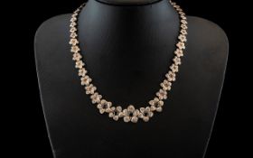 Top Quality Silver Floral Necklace, a statement necklace in the form of graduating flower petals,