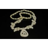 A 1930's Camel Bone Carved Necklace, probably North African, depicting carved camels. Measures