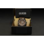 Gentleman's Guess Watch, brown leather strap, in original box with instructions and sales receipt.