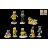 Royal Doulton 'Winnie the Pooh' Collection figures, comprising Pooh 'The More it Snows,