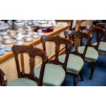 A Set of Six Solid Walnut Riley Bolt Back Patent Chairs each with a carved central splat,