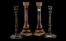 A Pair of Ruby Glass Candle Holders, gilt painted ruby glass supports, with metal mounts.