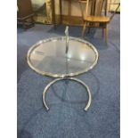 A Retro Chrome Coffee/Side Table, with a round glass top. Height 24" x 19" diameter.