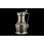 18th Century Pewter Flagon of large size, the handle grip with a two acorn moulded knop, the waisted