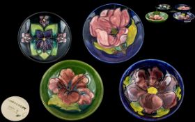 Four Pieces Of Moorcroft Pottery Two 5½ Inch Bowls And two 4½ Dishes