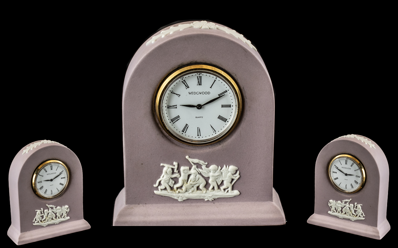 Wedgwood White on Lilac Jasperware Miniature Clock, rare colourway. Measures 3.5" tall.