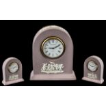 Wedgwood White on Lilac Jasperware Miniature Clock, rare colourway. Measures 3.5" tall.