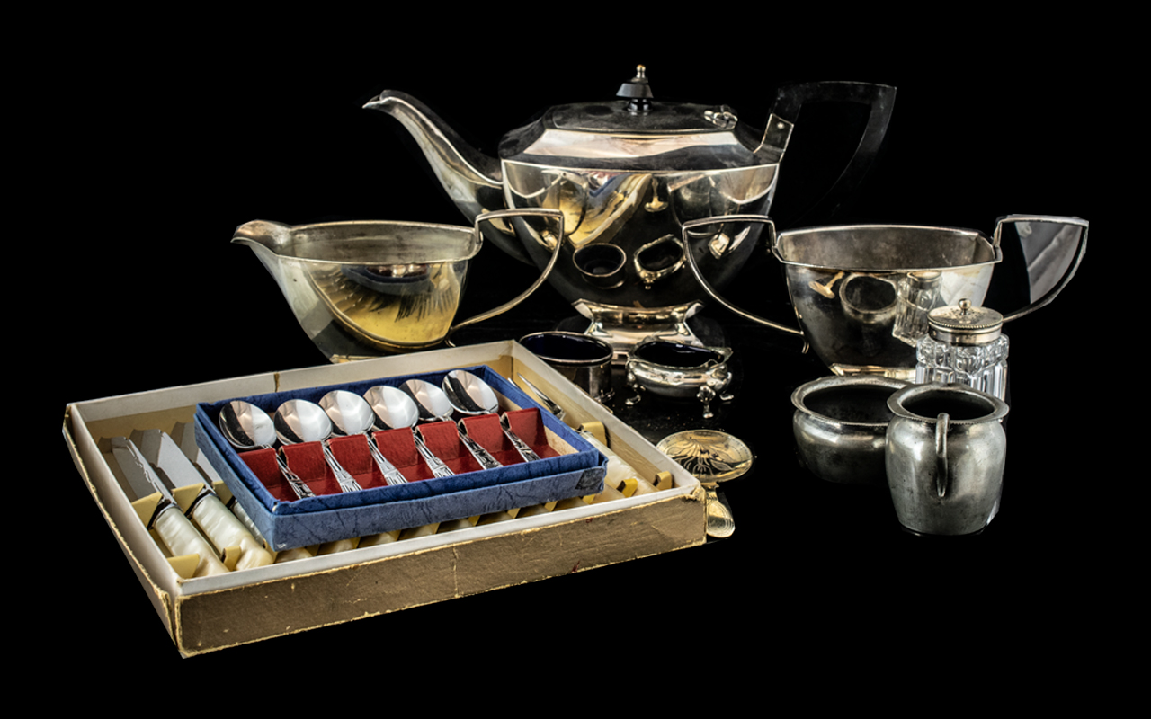 A Silver Plated Three Piece Teaset.