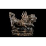 A Carved Wooden Griffin, raised on a rectangular carved plinth in Oriental style. Height 8.