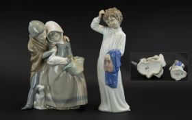 Pair of Nao Figures, comprising: boy and girl with a duck and puppy, measures 9.5'' tall; and a girl