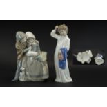 Pair of Nao Figures, comprising: boy and girl with a duck and puppy, measures 9.5'' tall; and a girl