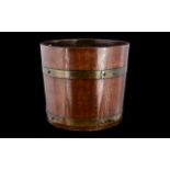 Arts and Crafts R Alister & Co Planter, a late 19th/ early 20thC brass bound planter,