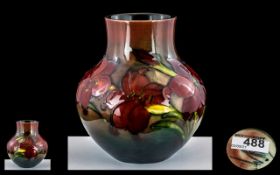William Moorcroft Signed Bulbous Shaped Flambe Vase ' Orchids ' Design. c.1930's. Height 5.