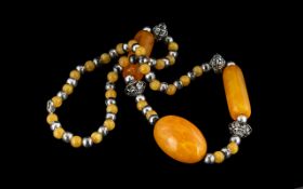 African Vintage Large Statement Necklace, amber plastic with white metal spacers,